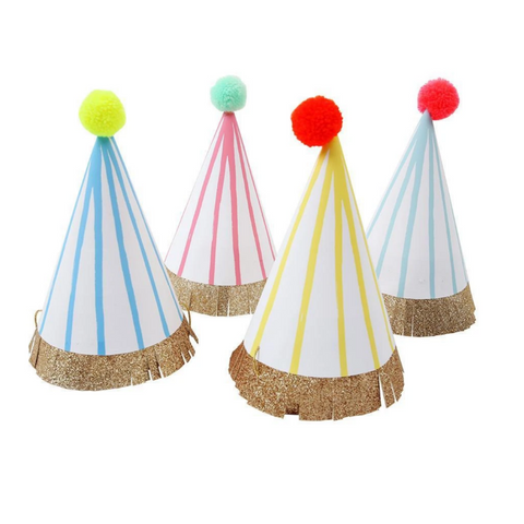 different colored party hats with different colored pom poms on top 