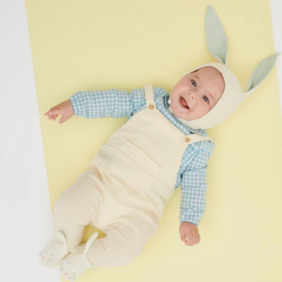 baby in rabbit bonnet