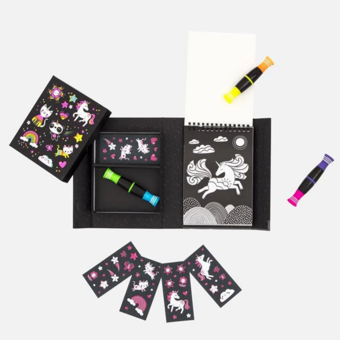 inside of box showing markers stickers and coloring pages