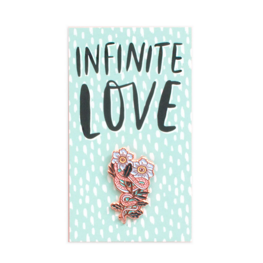 pin of snake wrapped around flowers on card that reads "infinite love"