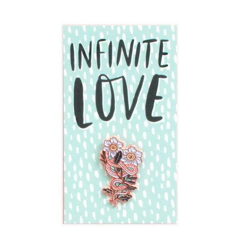 pin of snake wrapped around flowers on card that reads "infinite love"