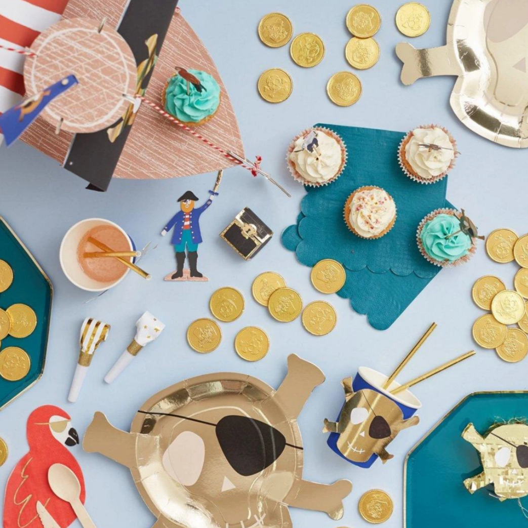 table covered in pirate themed party items 