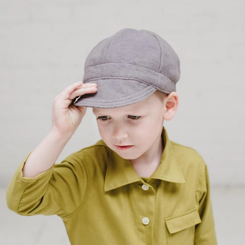 boy wearing a grey cap