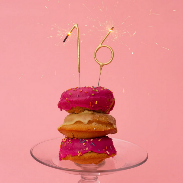 numbers 16 sparklers on donuts