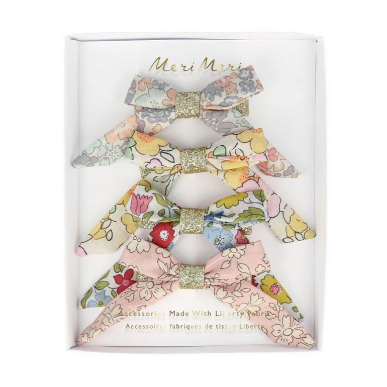 fabric bow hair clips in packaging 