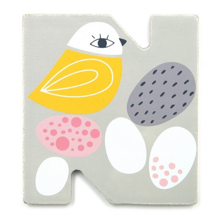 This is the letter N. It is a thin piece of wood, grey with eggs and a yellow bird. By Suzy Ultman