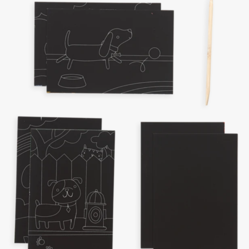 black sheets with line drawings of dogs before color has been scratched off