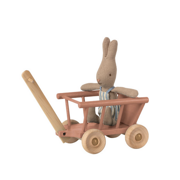 rabbit doll riding in wagon