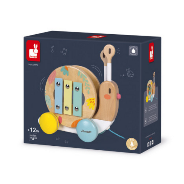box that holds the wooden snail pull toy featuring a tambourine and a small xylophone