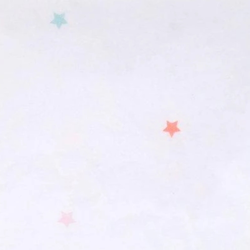 light red, green and pink stars on white table cloth