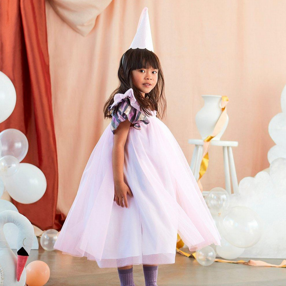 girl wearing pink tulle dress with pink princess crown on head