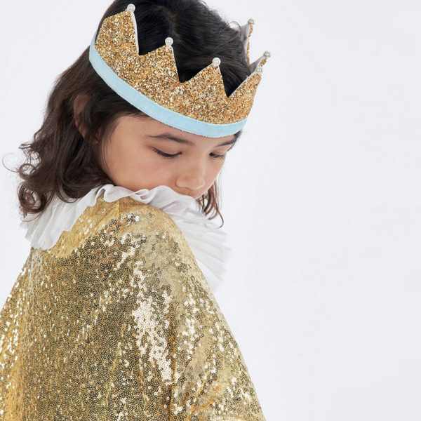 girl wearing gold cape and gold crown
