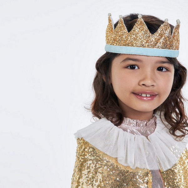 smiling girl wearing gold crown 