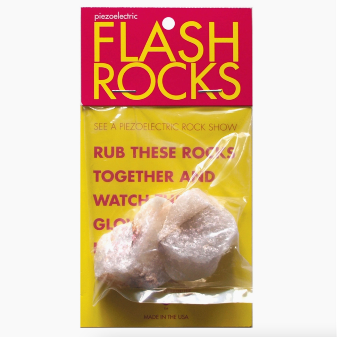 flash rocks packaging with rocks. reads "see a piezoelectric rock shw. Rub these rocks together and watch"