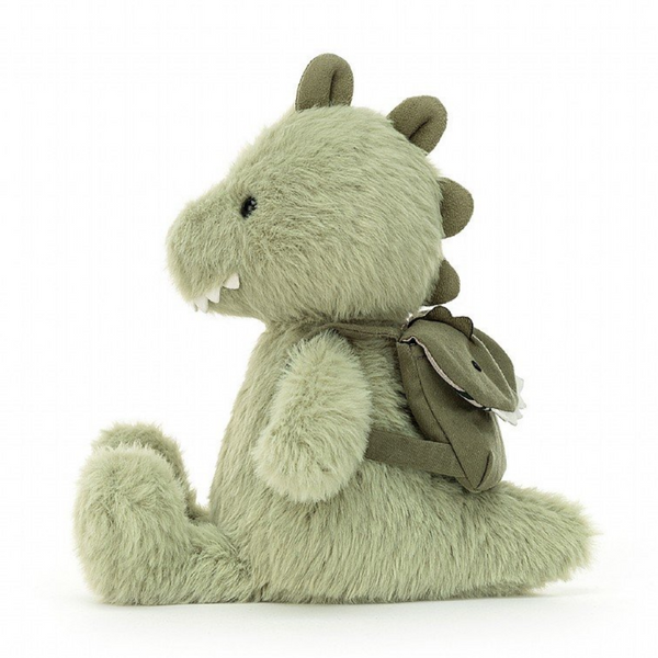 side view of jellycat dinosaur wearing backpack