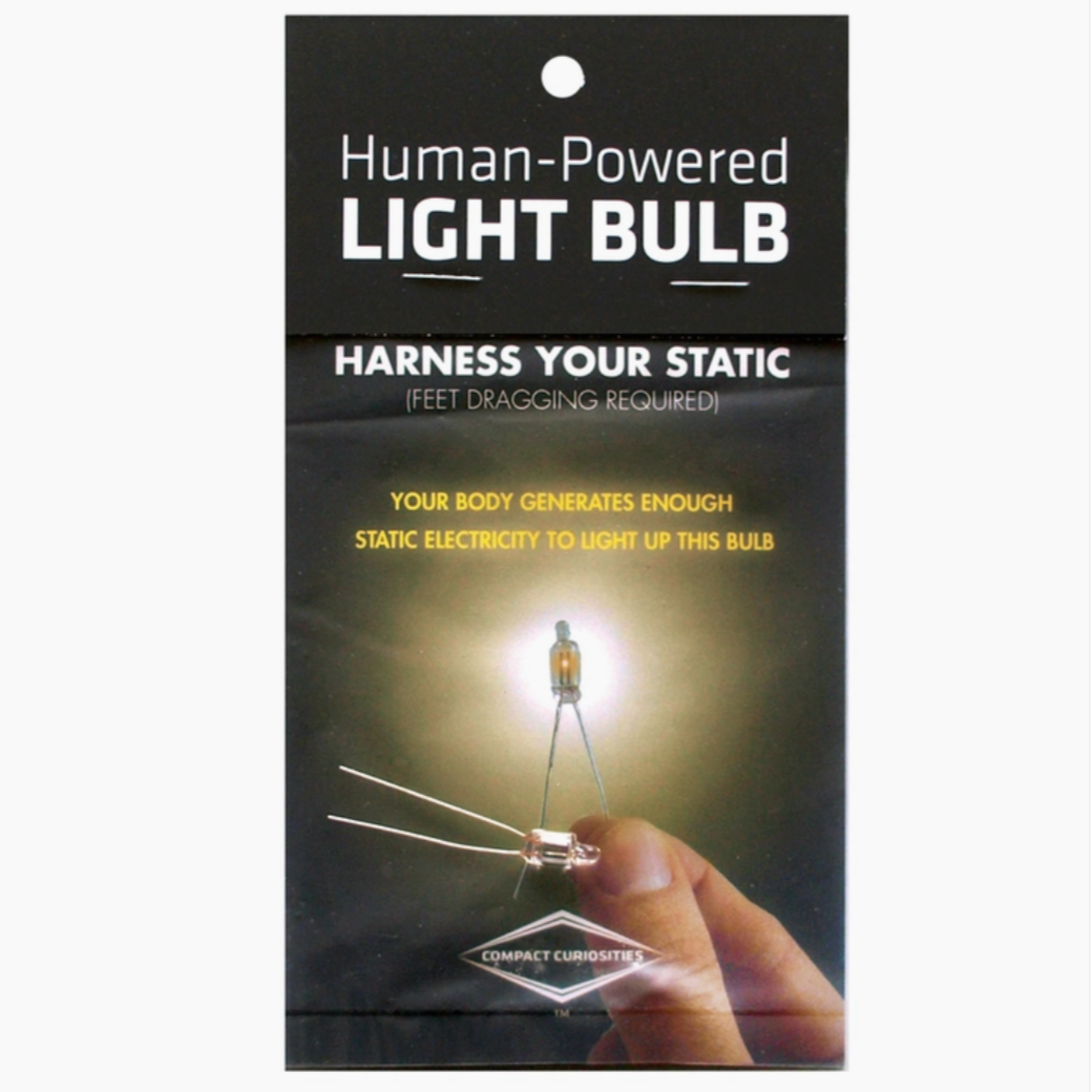packaging with picture of hand holding light bulb wires. reads " human-powered light bulb. harness your static"