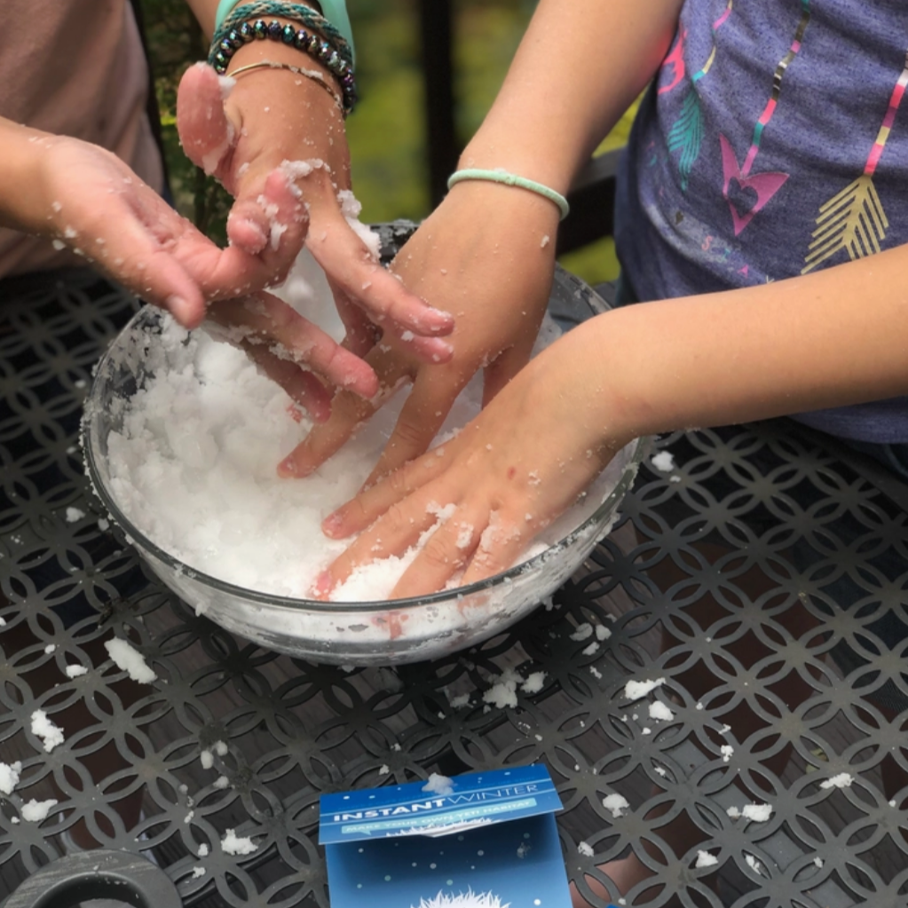 two kids playng in a bowl with yeti mix