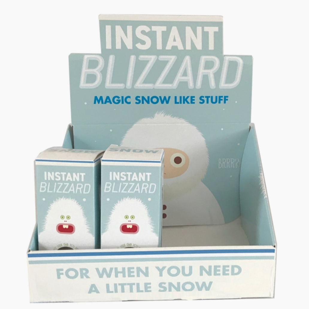 Instant blizzard box with two smaller boxes of Instant Blizzard that says "Magic Snow Like Stuff"