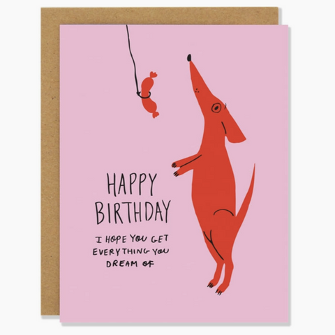 pink weiner dog with sausage on a string reading "Happy Birthday I hope you get everything you dream of"