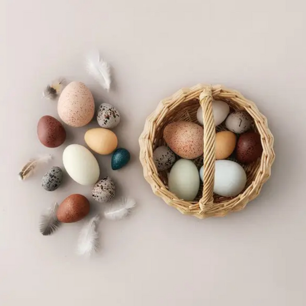 A Dozen Wooden Bird Eggs in a Basket