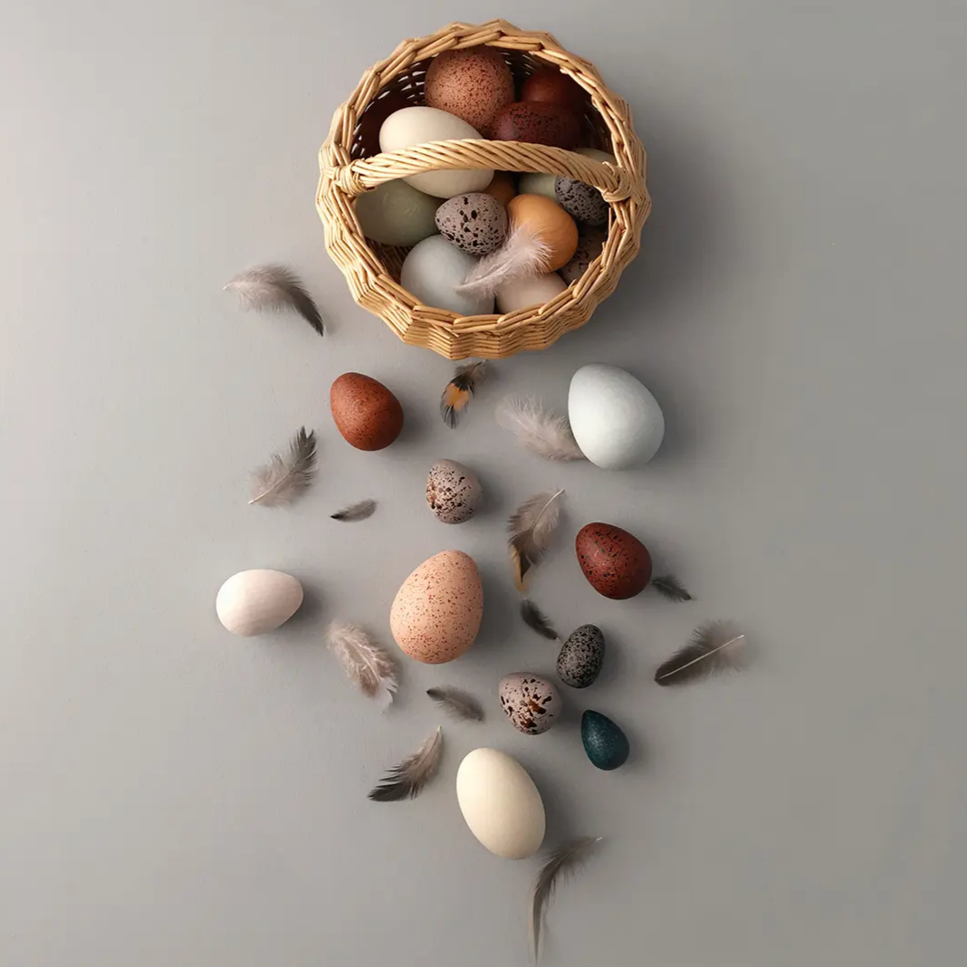 A Dozen Wooden Bird Eggs in a Basket