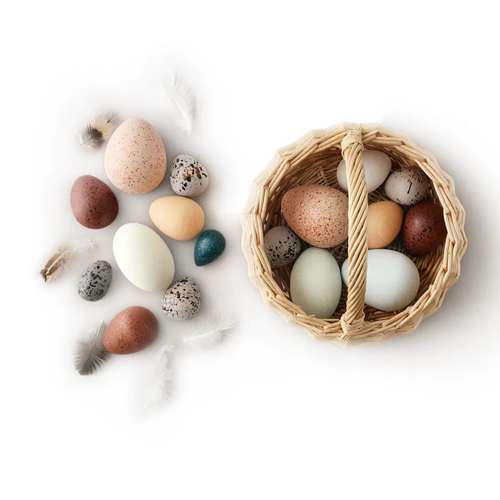 A Dozen Wooden Bird Eggs in a Basket