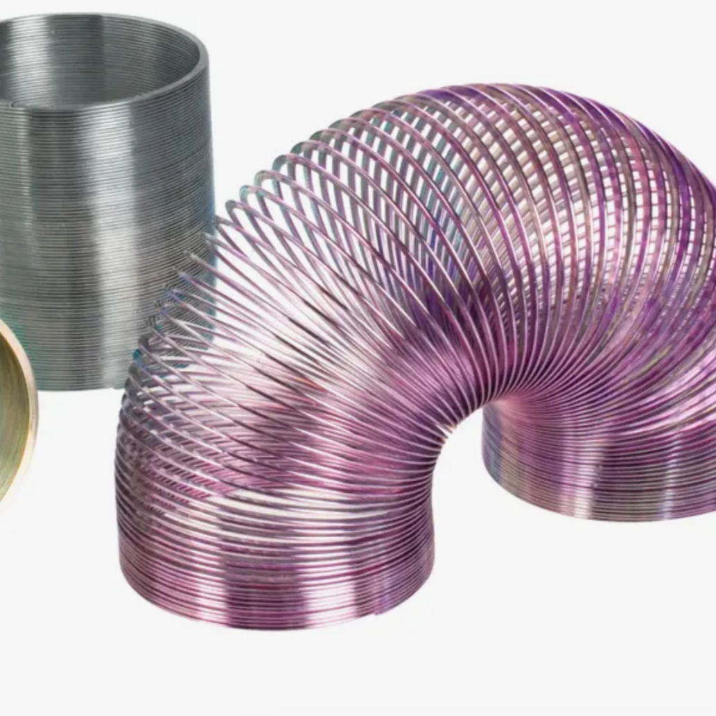 A set of three coiled metal springs with assorted colors, the middle spring is highlighted and appears to be purple or pinkish in color.