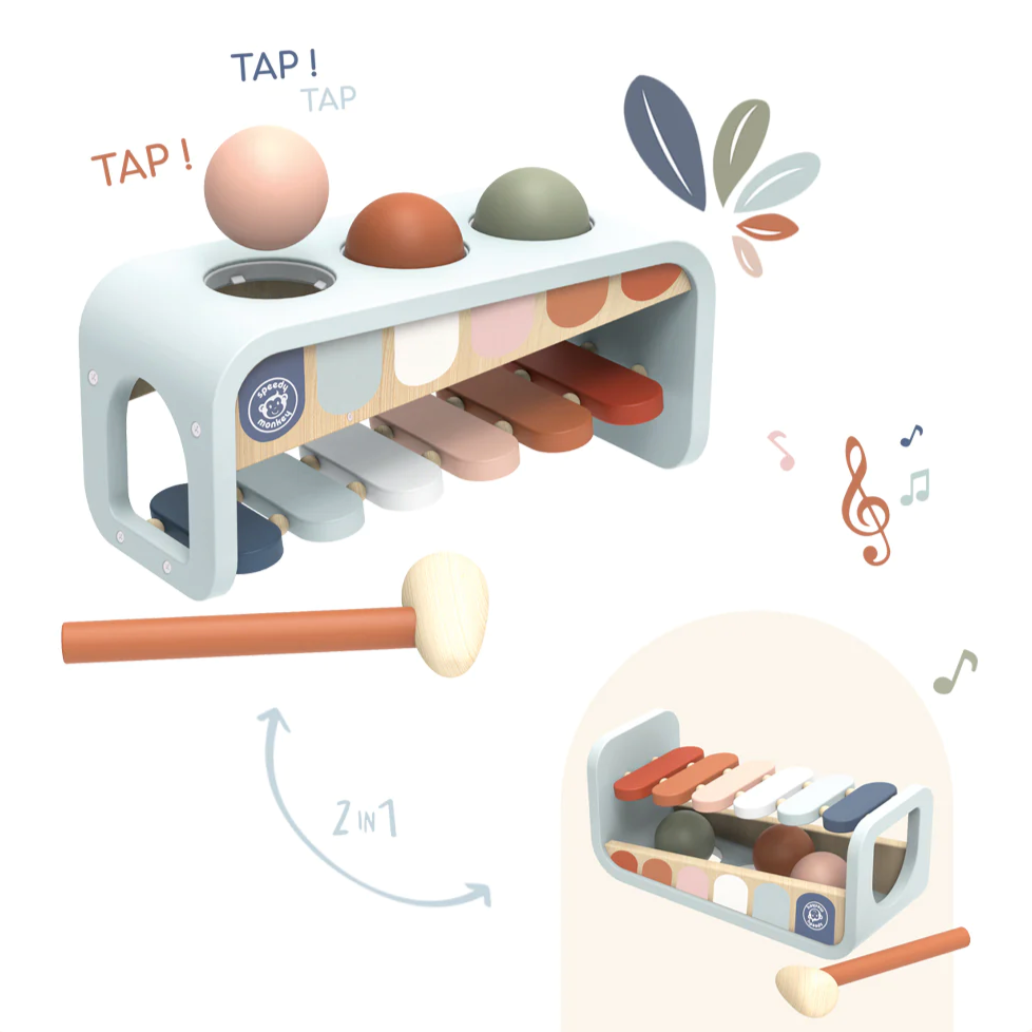 Children's musical instrument with colorful balls and a mallet on a white background