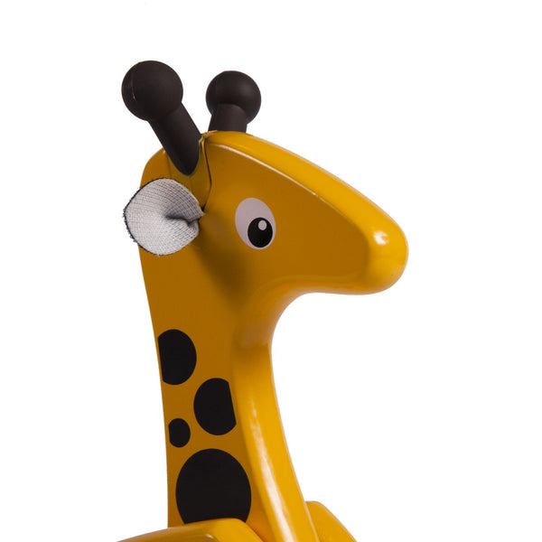 close up of wooden, yellow giraffe pull toy