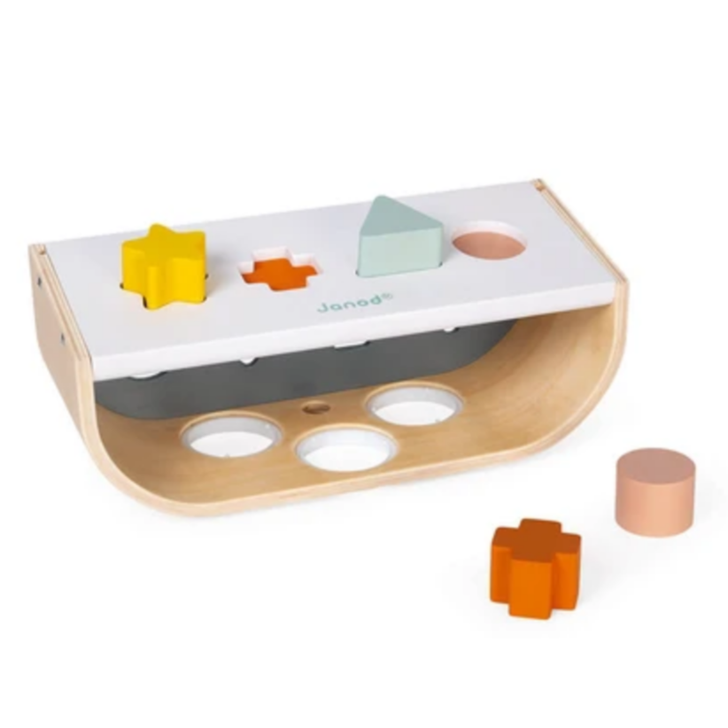 curved box with different colored shapes fitting into shaped holes