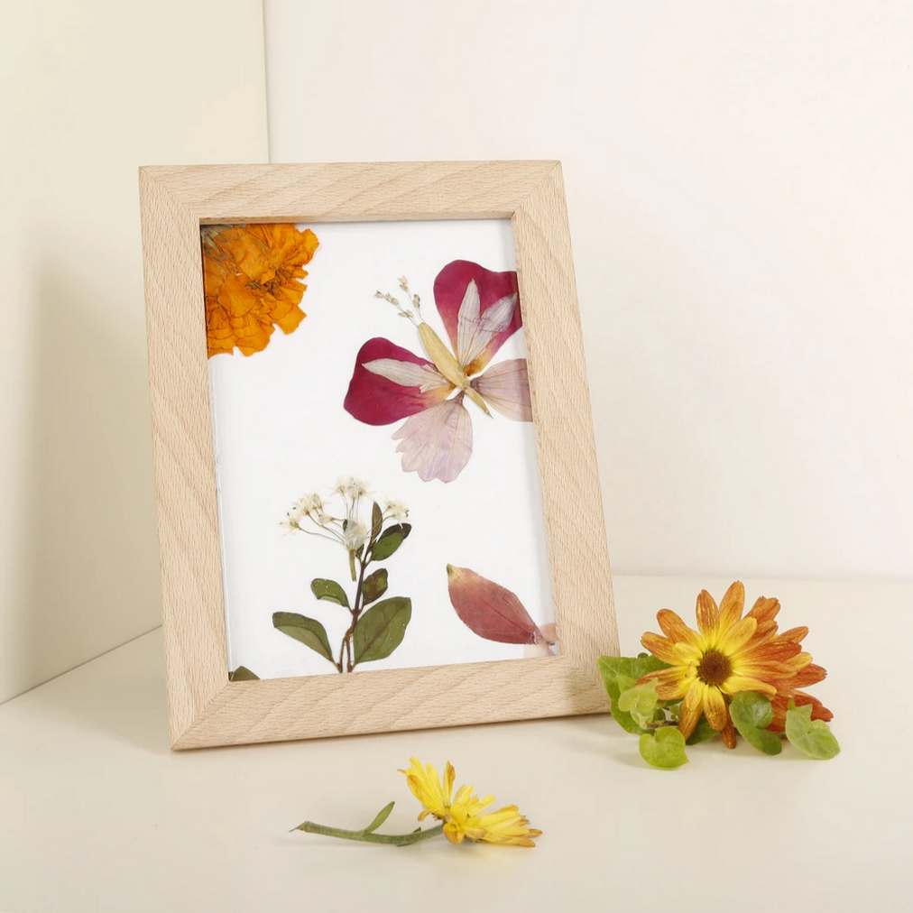 art frame next to flowers