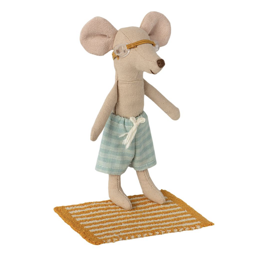 little mouse wearing goggles and standing on yellow striped towel