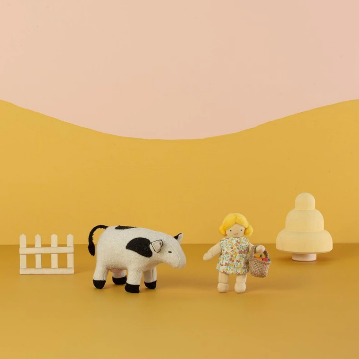 doll next to cow