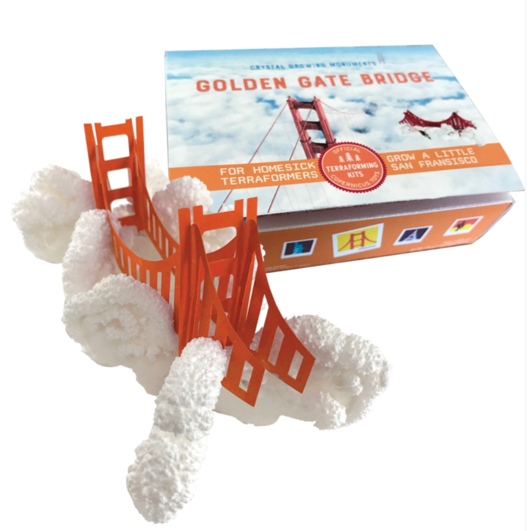 box with paper golden gate bridge with puffy clouds underneath