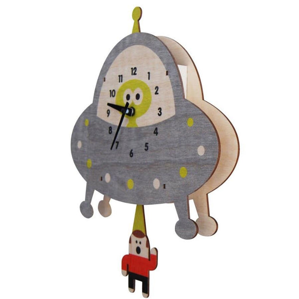 side view of wooden clock with laser cut alien saucer beaming up a human wearing red shirt
