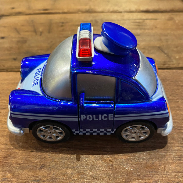 blue plastic police car with police hat on top