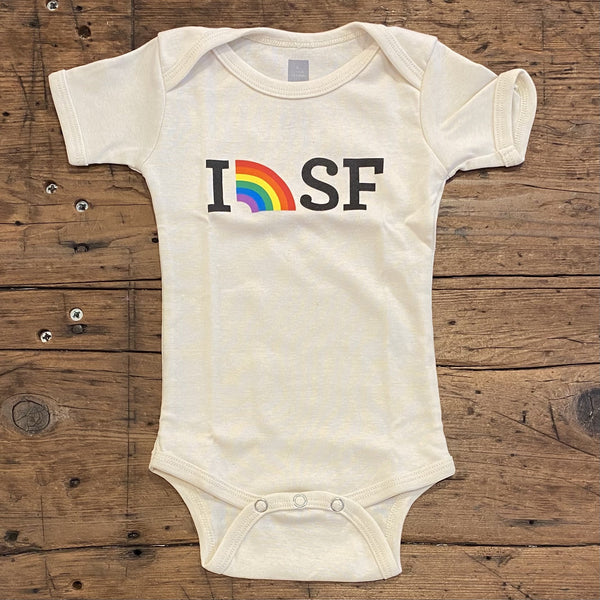 cream colored onesie with I (picture of a rainbow) SF written across the top