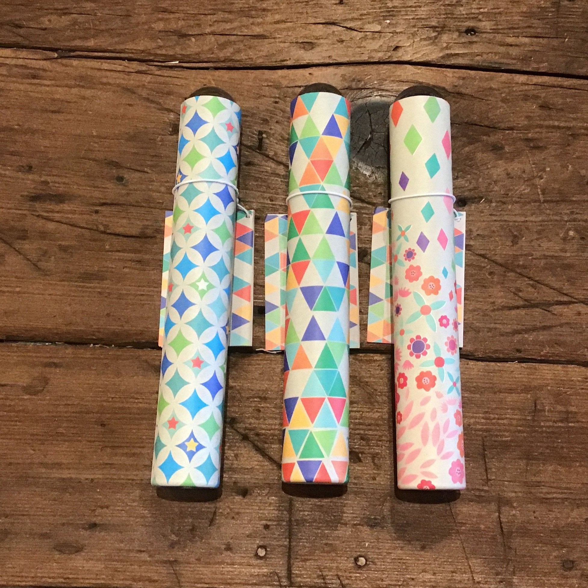 the three tubes in a row on wooden background