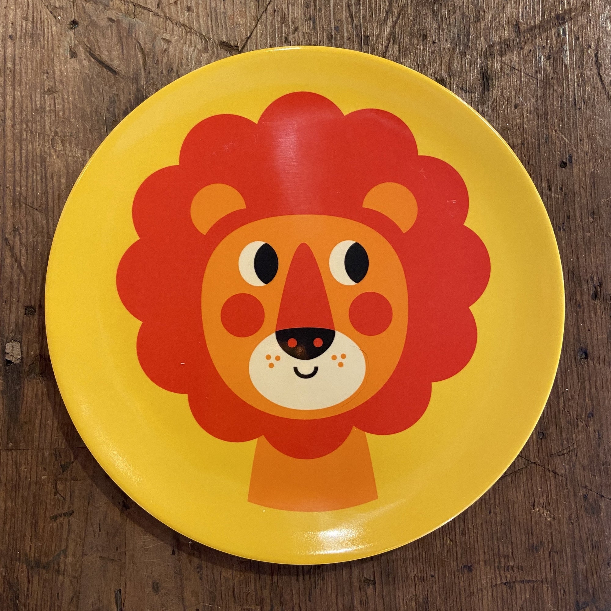 yellow plate with orange lion