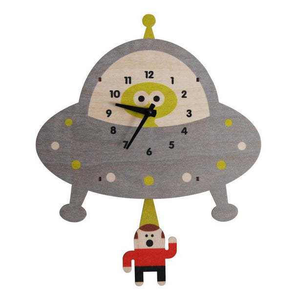 wooden clock with laser cut alien saucer beaming up a human wearing red shirt